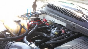 Under the hood of CNG Chevy Suburban, showing regulator, and fill valve.